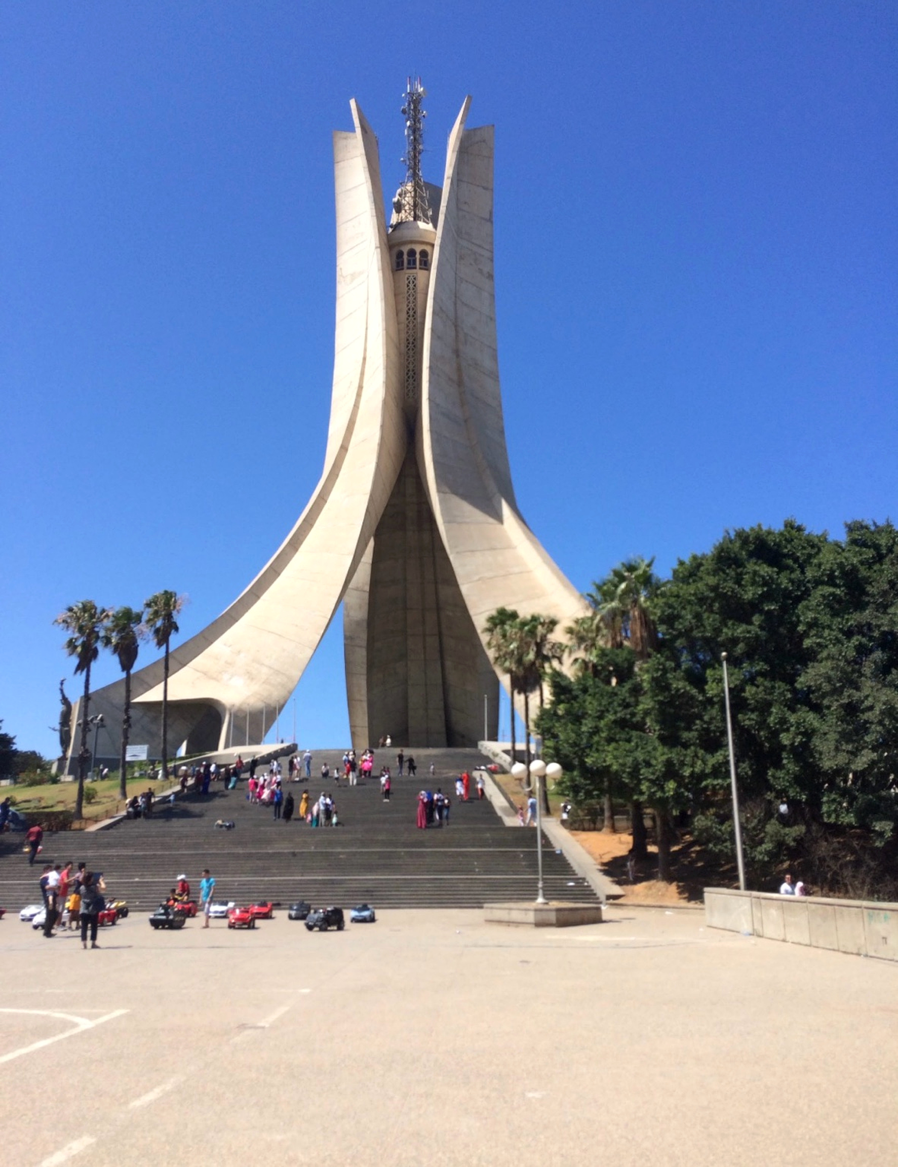 Monument rising above a public square in Algeria