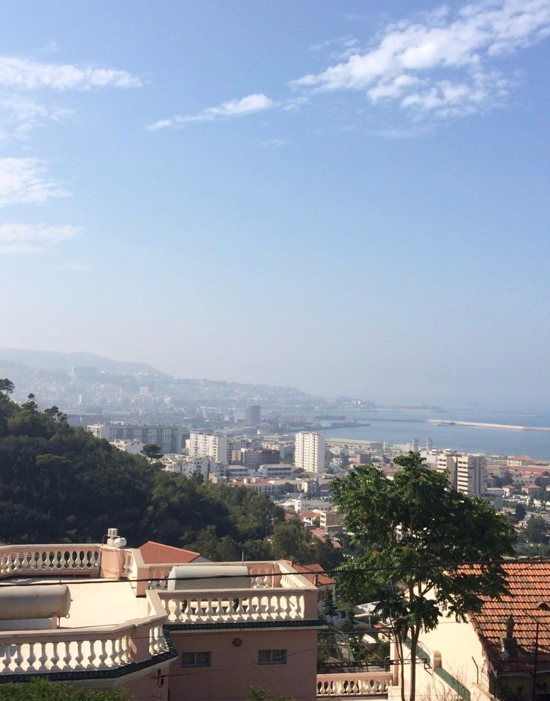 View across an Algerian coastal city toward the sea